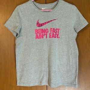 Nike grey t-shirt with pink logo.